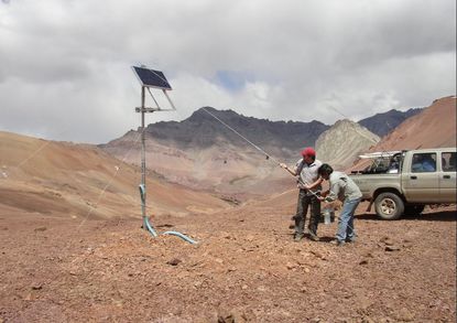 Picture Geophysicists setting up solar panel